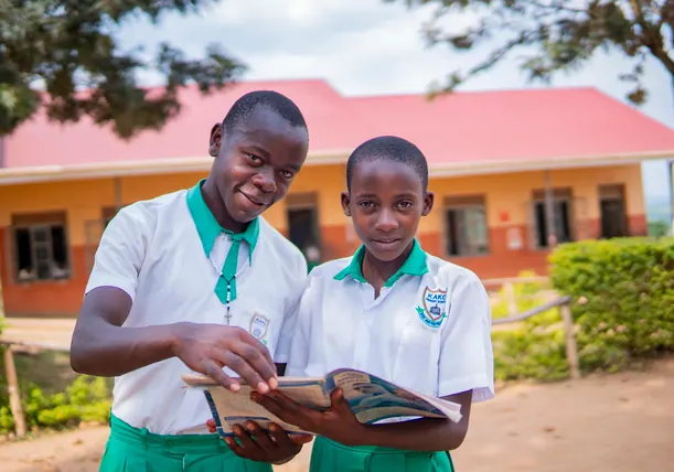 Two secondary school learners reading together
